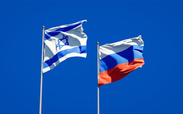 Beautiful national state flags of Israel and Russia together on blue sky. 3D artwork