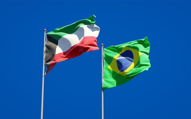 Beautiful national state flags of Kuwait and Brasil together on blue sky