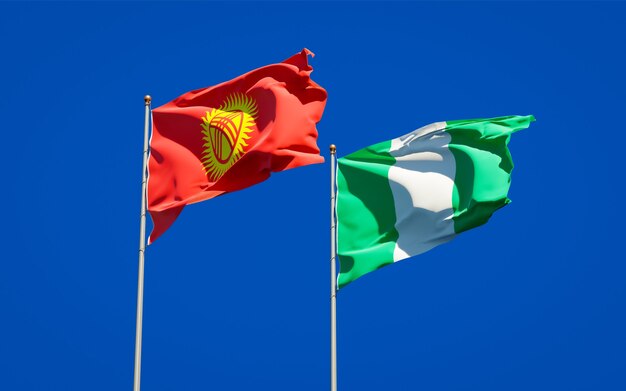 Beautiful national state flags of Kyrgyzstan and Nigeria together on blue sky