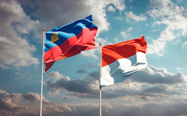 Beautiful national state flags of Liechtenstein and Indonesia together on blue sky