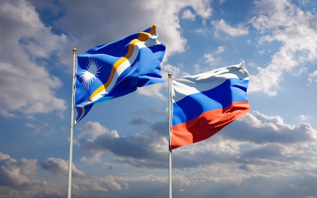 Beautiful national state flags of Marshall Islands and Russia together on blue sky. 3D artwork