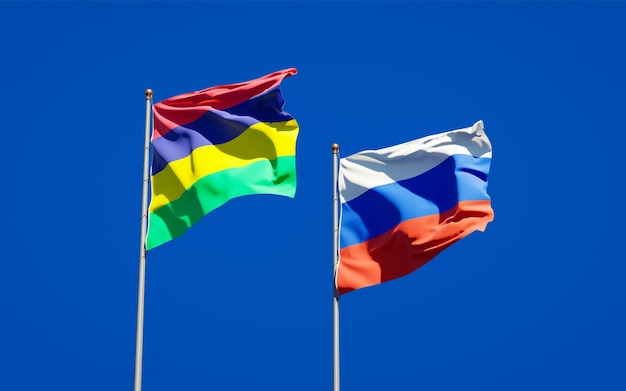 Beautiful national state flags of Mauritius and Russia together on blue sky. 3D artwork