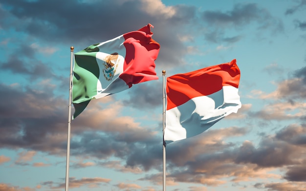 Beautiful national state flags of Mexico and Indonesia together on blue sky