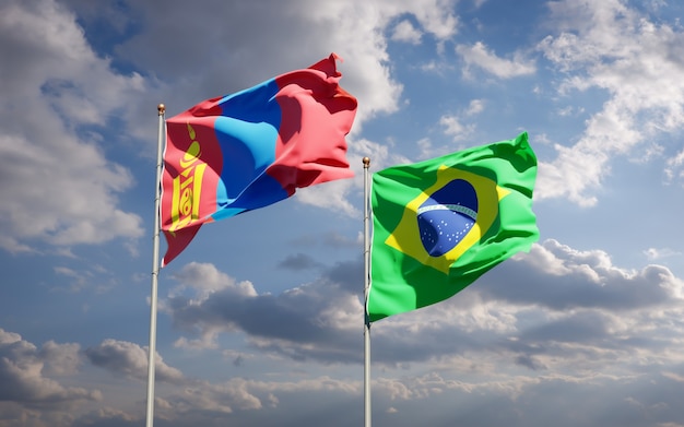 Beautiful national state flags of Mongolia and Brasil together on blue sky