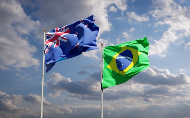 Beautiful national state flags of New Zealand and Brasil together on blue sky