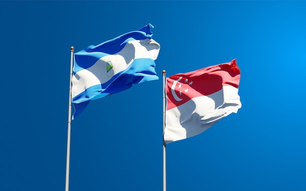 Beautiful national state flags of Nicaragua and Singapore together