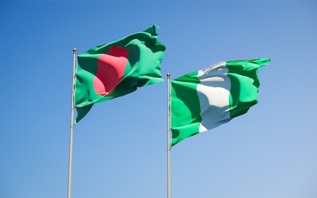 Beautiful national state flags of nigeria and bangladesh together on blue sky