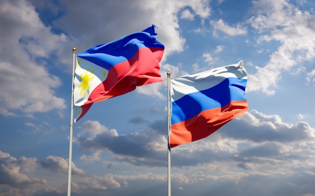 Beautiful national state flags of Philippines and Russia together on blue sky. 3D artwork