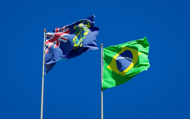 Beautiful national state flags of Pitcairn Islands and Brasil together on blue sky