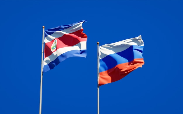 Beautiful national state flags of Russia and Costa Rica together on blue sky. 3D artwork