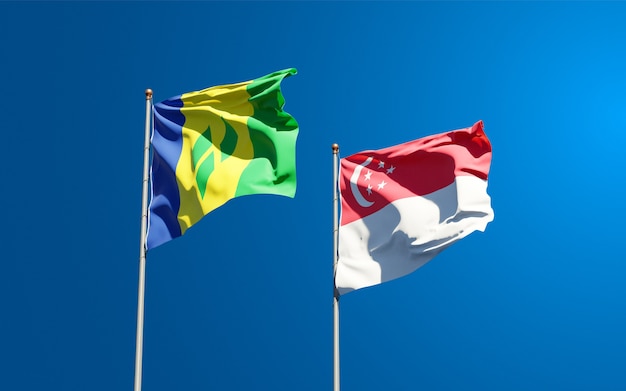 Beautiful national state flags of Saint Vincent and the Grenadines and Singapore together