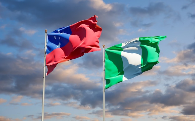 Beautiful national state flags of Samoa and Nigeria together on blue sky