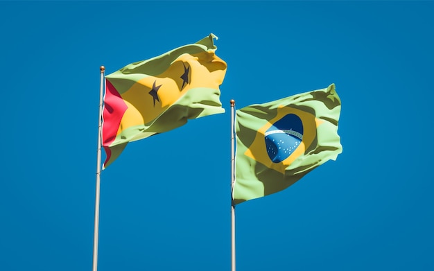 Photo beautiful national state flags of sao tome and principe and brasil together on blue sky