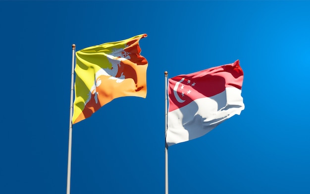 Beautiful national state flags of Singapore and Bhutan