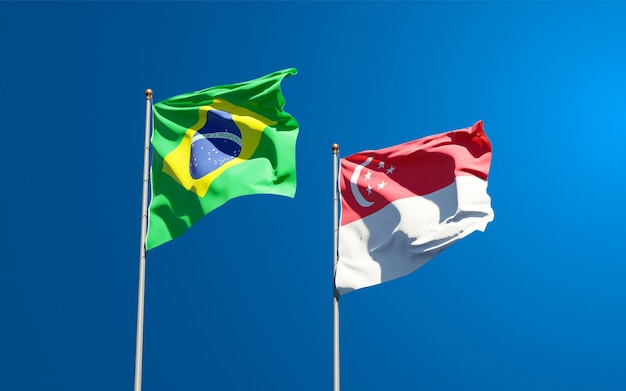 Beautiful national state flags of Singapore and Brasil