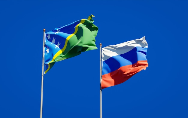 Beautiful national state flags of Solomon Islands and Russia together on blue sky. 3D artwork