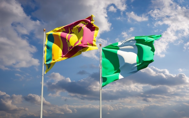 Beautiful national state flags of Sri Lanka and Nigeria together on blue sky