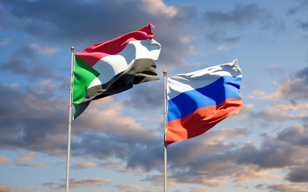 Beautiful national state flags of Sudan and Russia together on blue sky. 3D artwork