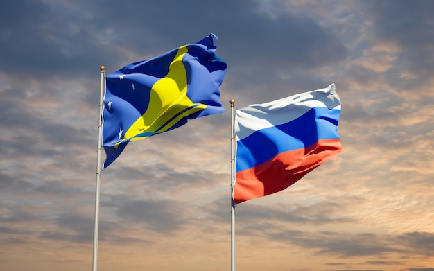 Beautiful national state flags of Tokelau and Russia together on blue sky. 3D artwork