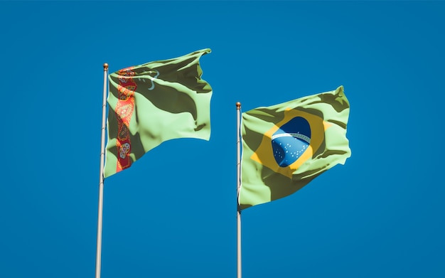 Beautiful national state flags of Turkmenistan and Brasil together on blue sky