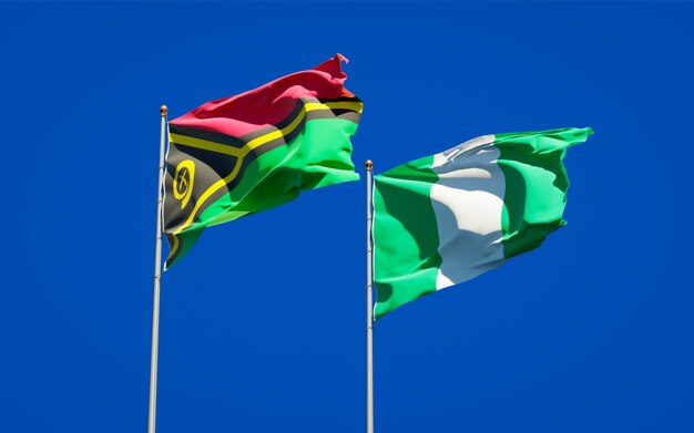 Beautiful national state flags of Vanuatu and Nigeria together on blue sky