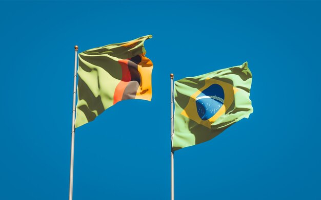 Beautiful national state flags of Zambia and Brasil together on blue sky