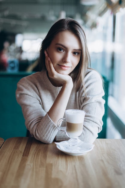 Beautiful natural woman in a cafe