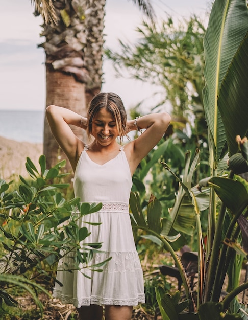 Beautiful and natural woman enjoying nature on a summer day Vacation and adventure concept