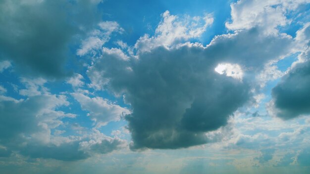 Beautiful nature rainy clouds moving in opposite direction at sunset time fluffy white clouds slow