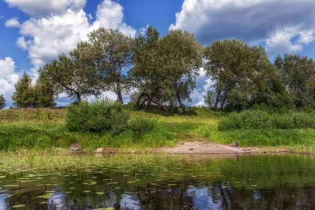 The beautiful nature of Russia A beautiful river with trees beaches on the shore Beautiful clouds