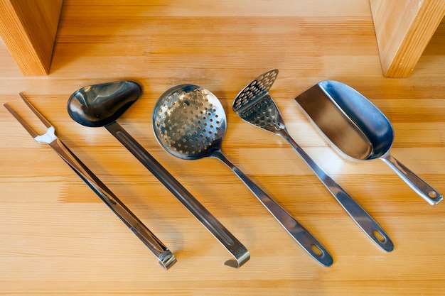 Beautiful new cooking tools on a wooden table