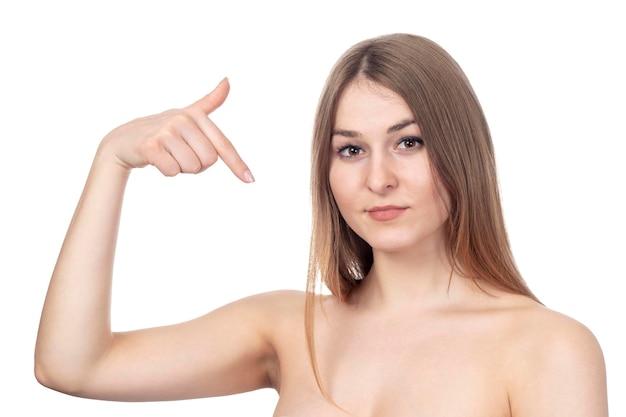 beautiful nude sexy woman points finger at herself isolated on white background