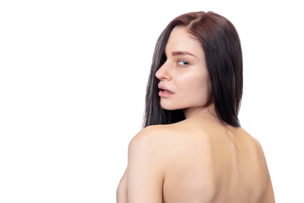 beautiful nude woman turned over shoulder, back view, isolated on white background