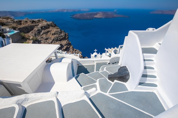 Beautiful Oia town on Santorini island, Greece. White entrance and stairs sea view, wonderful street