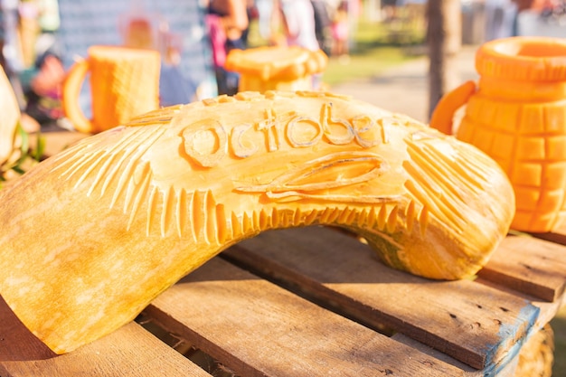 Beautiful oktober fest decoration made of orange pumpkins with carved oktober fest lettering