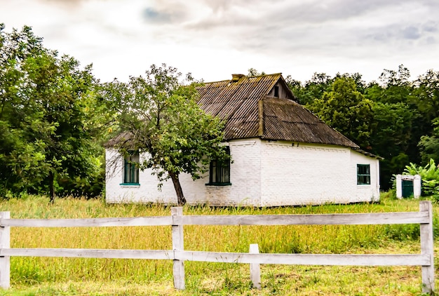 Beautiful old abandoned building farm house in countryside on natural background photography consisting of old abandoned building farm house at wild grass old abandoned building farm house over sky