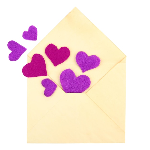 Beautiful old envelope with decorative hearts, isolated on white