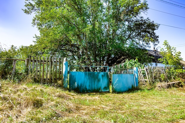 Beautiful old gate from abandoned house in village on natural background photography consisting of old gate for house to village old gate out village house at wild natural big light foliage close up