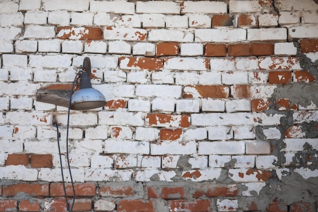 Beautiful old rusty truck parked by a old brick wall