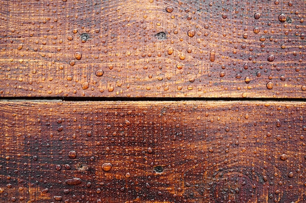 Bella vecchia superficie di legno ricoperta di gocce di pioggia bella vista dall'alto di sfondo