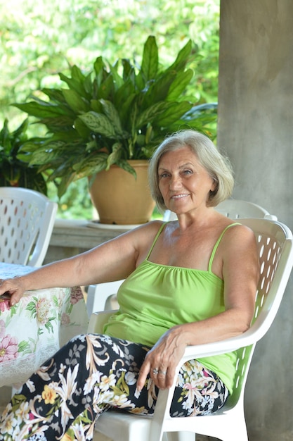 Beautiful Older woman resting at tropical resort