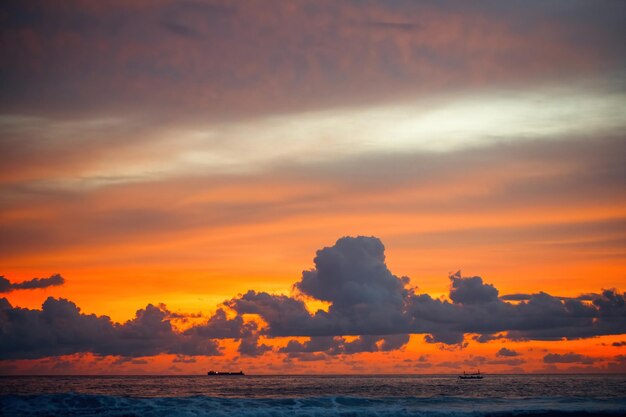 Beautiful orange sunrise wtih clouds on the sea