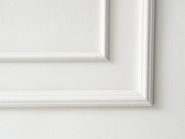 Beautiful ornate white decorative mouldings in studio Decorative stucco in the classic interior of the house The angle of the frame molding white for clipart White cement plaster wall background