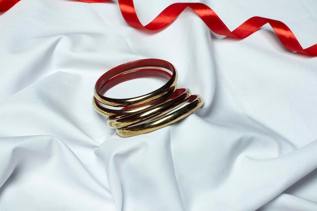 Beautiful oxidised jewellery on white silk cloth and red and black ribbon