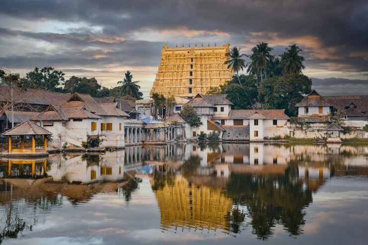 Beautiful Padmanabhaswamy temple reflected in a pond at sunset, Thiruvananthapuram city, Kerala, south India