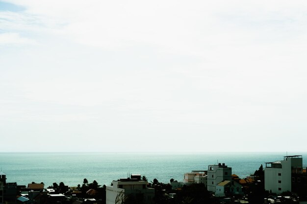 Beautiful panorama seaside town view real natural landscape photo background Rooftops Sea merges horizon skyline Calm peaceful life romance Pale blue white gray bright frame vignette more stock