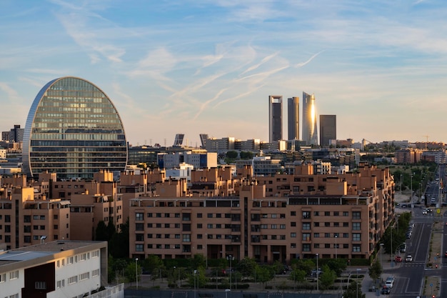 Beautiful panoramic view of Madrid Spain at sunset with blue sky and sunlight reflections