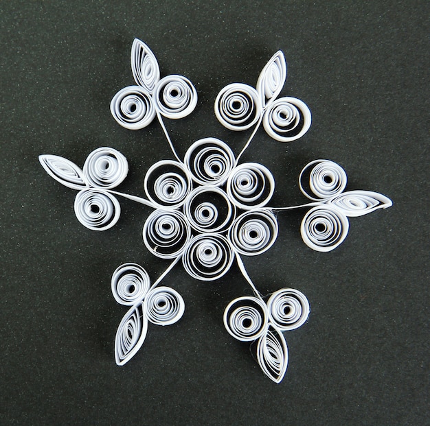 Beautiful paper snowflake, on black background