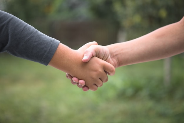 Beautiful Peace Symbol - Child Holding Hands. Handshake boys