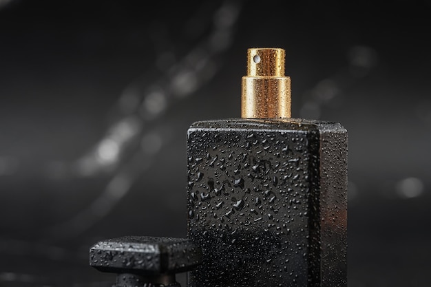 beautiful perfume bottle on black marble background